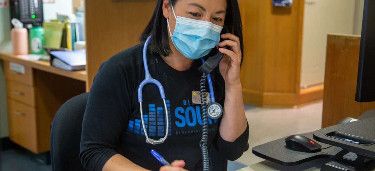 Canuck Place Nurse on phone to answer the 24-Hour Clinical Care Line