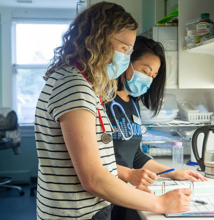 Two Canuck Place nurses doing pediatric palliative care research on the clinical floor of Canuck Place Children's Hospice