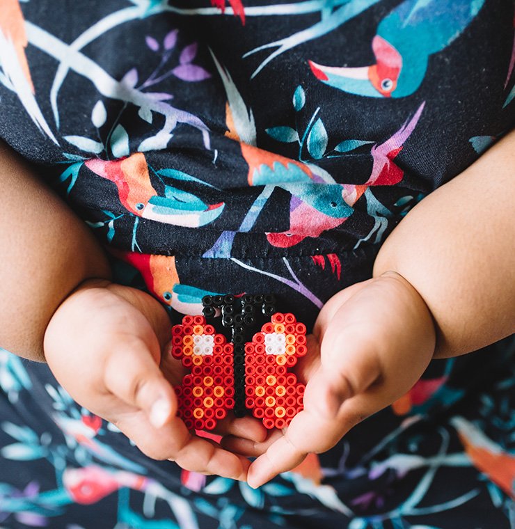 Canuck Place child holding Lego heart