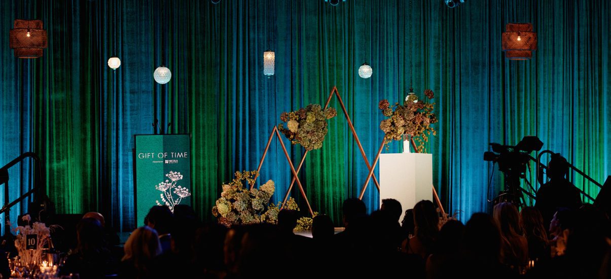 Gift of Time stage decorated with floral decor