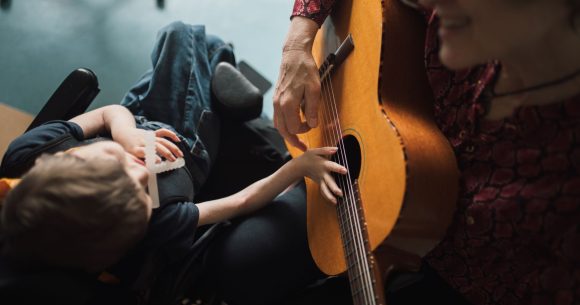 Child during music therapy session in pediatric palliative care