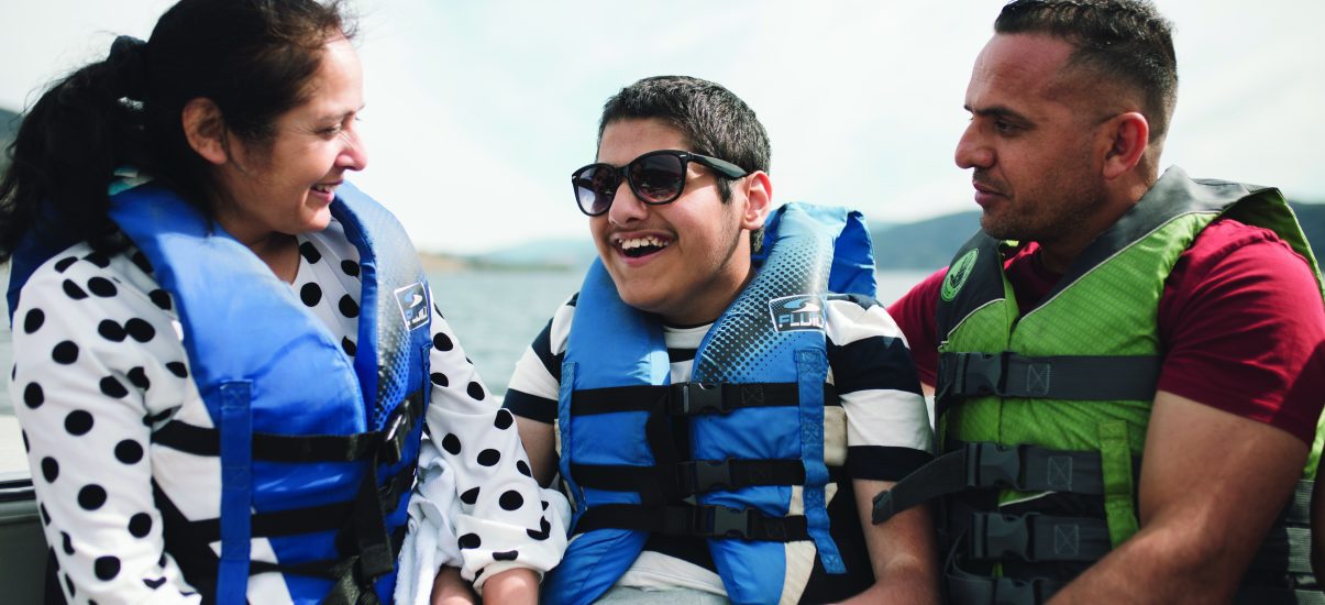 Canuck Place family the Grewals enjoying a boat ride for recreation therapy at Canuck Place