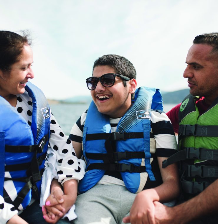 Canuck Place family the Grewals enjoying a boat ride for recreation therapy at Canuck Place