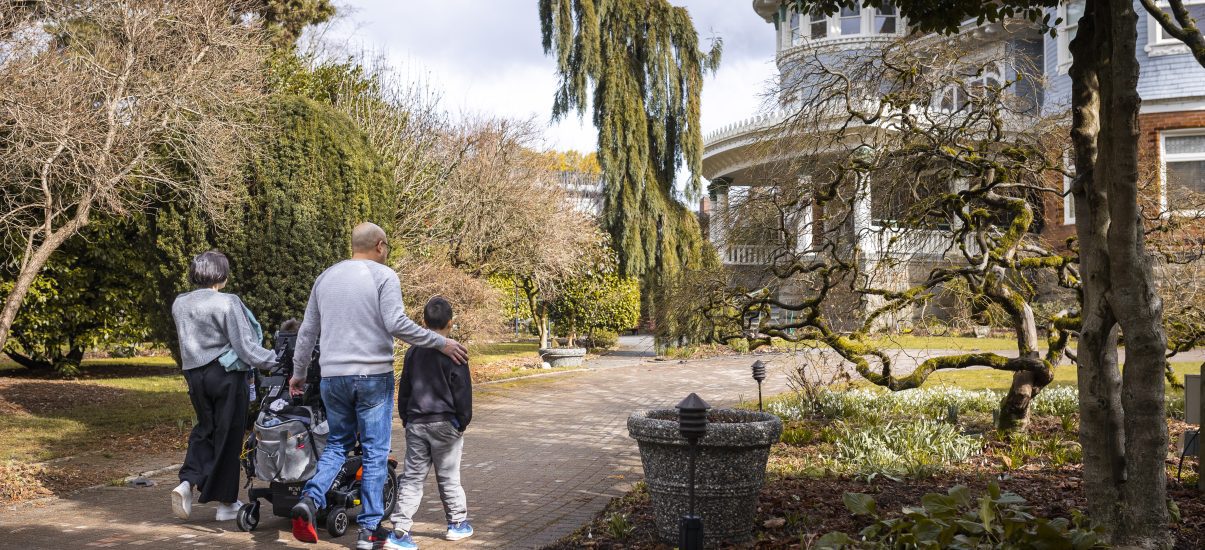 Family walking towards Canuck place