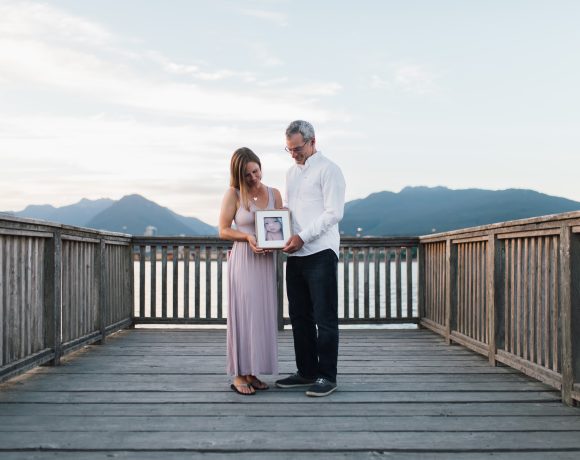 Marie and Wes Toews with a picture of baby Sophia