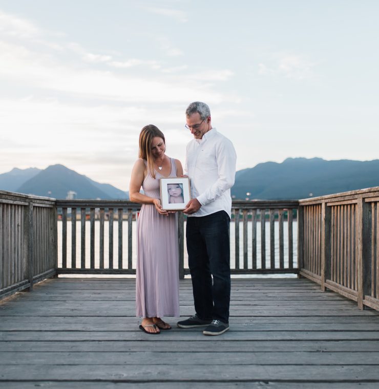 Marie and Wes Toews with a picture of baby Sophia