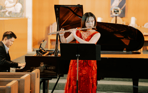 Rachel Wei performs for Canuck Place on her flute