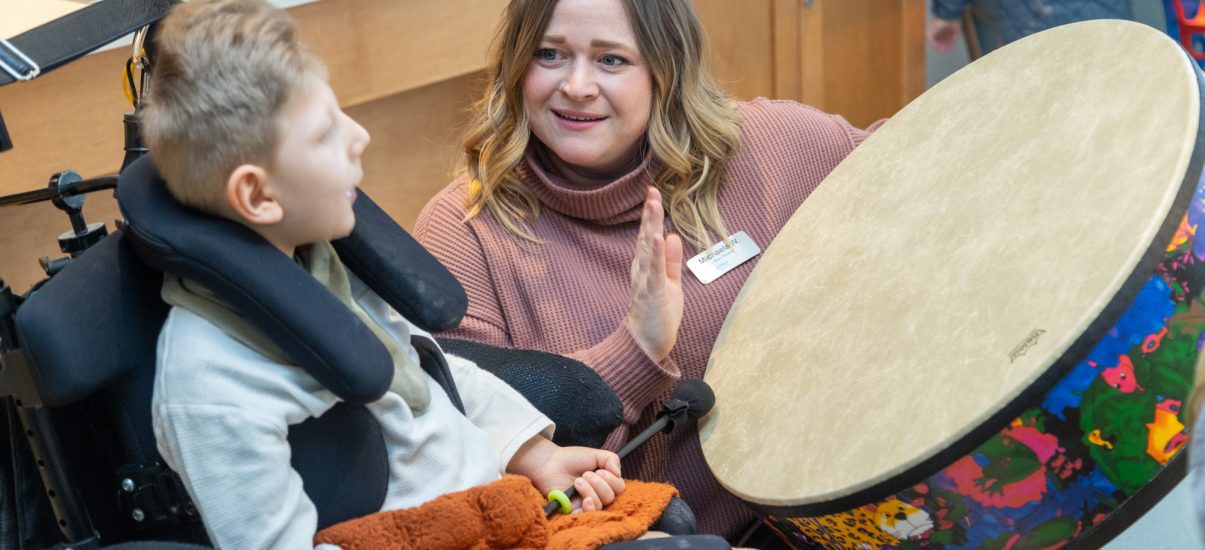 The Braun family enjoy a Music Therapy sessions with Canuck Place Music Therapist Michaela Wallis.