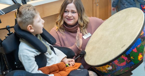 The Braun family enjoy a Music Therapy sessions with Canuck Place Music Therapist Michaela Wallis.